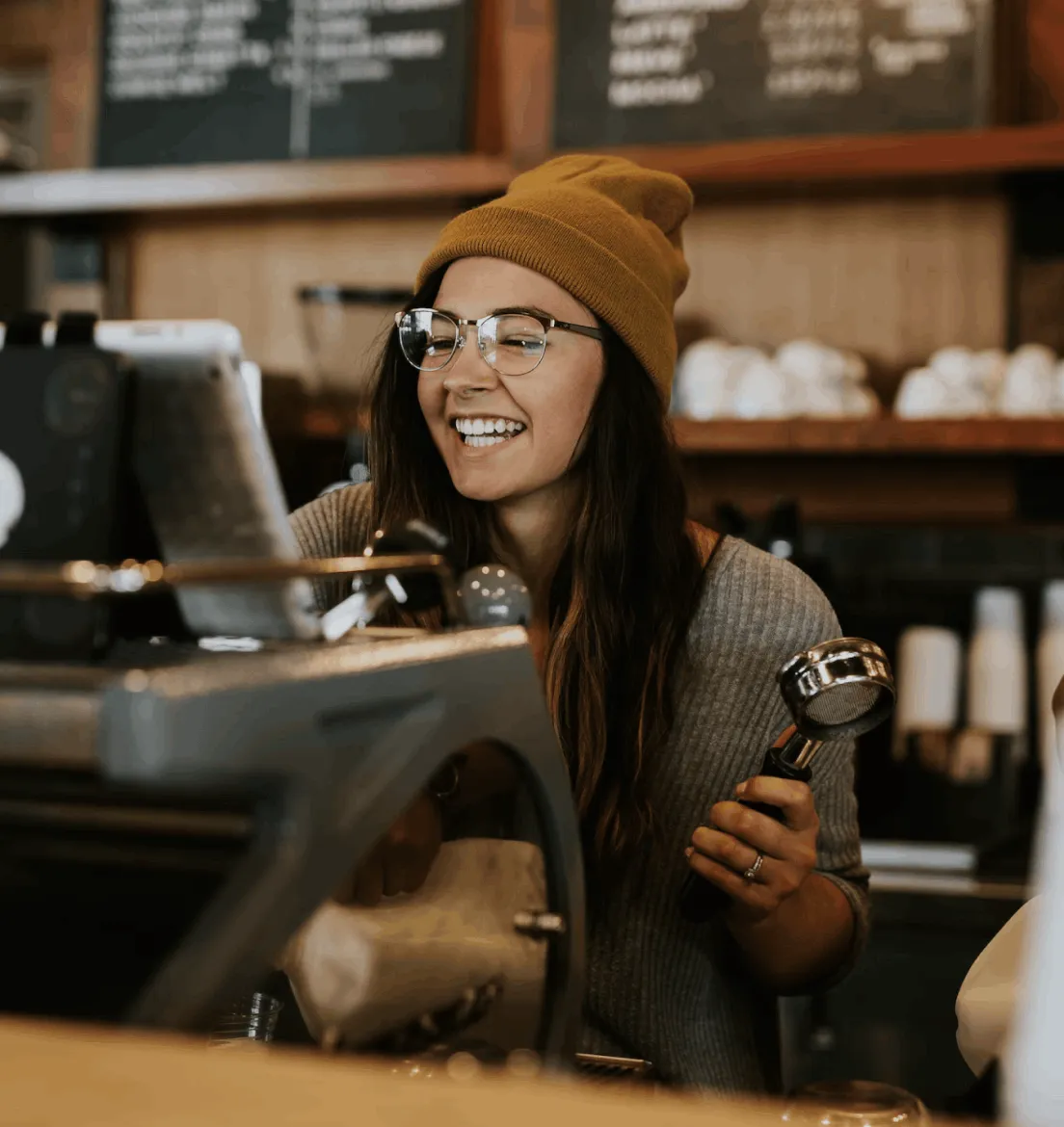 Girl making coffee smiling oreka